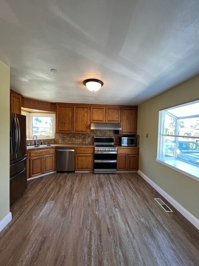 Building Photo - Spacious 4-Bedroom Retreat Just Steps from...