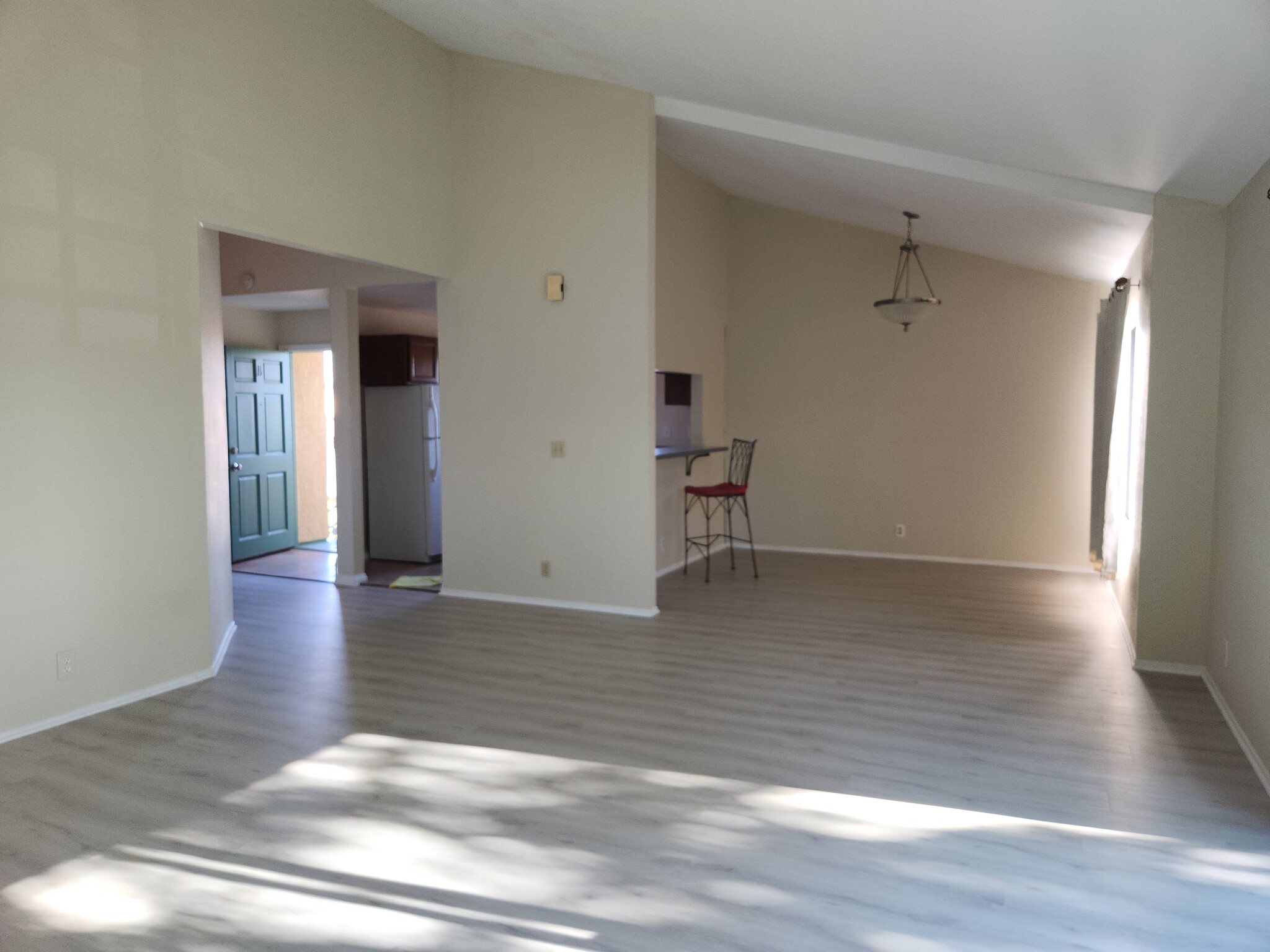 Living Room with view of Dining Room, Kitchen, and Front Door - 1208 Roswell Ave