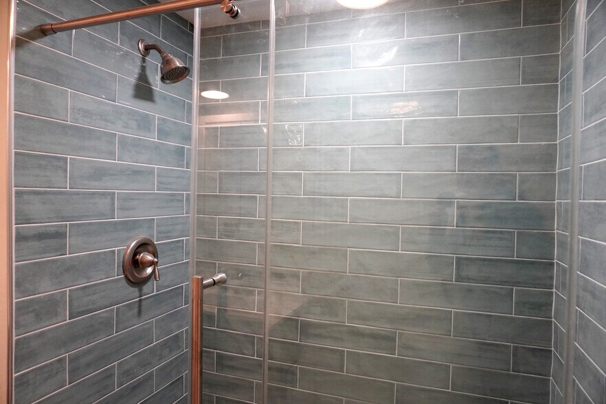 Luxury shower in blue tiles, a refreshing escape after Yankeetown's rivers and trails. - 33 63rd St