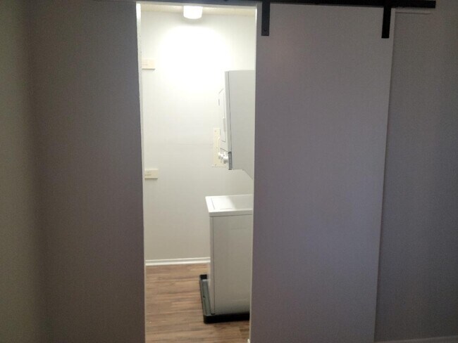 walk in closet with washer/dryer - 5831 Harvest Hill Rd