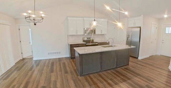 Building Photo - Newly Built! + Stainless Steel Appliances + 3-Car-Garage + Large Backyard + Washer & Dryer Includ...