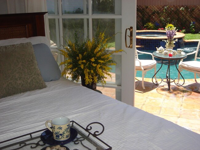 Romantic Master overlooking pool with French - 14024 Peach Grove St