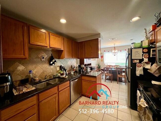 Building Photo - Available July 18: 3 bedroom, 2.5 Bath Duplex with Garage and Fenced Yard