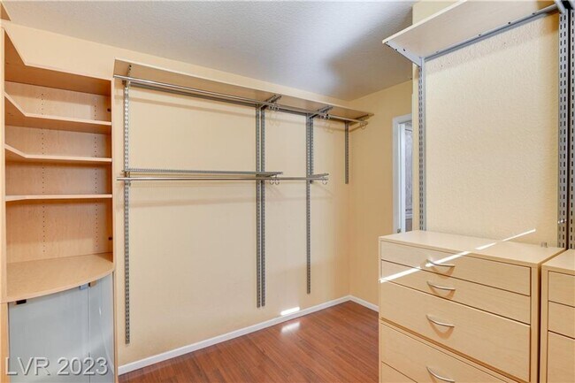 Building Photo - 4 BEDROOM HOME WITH PRIMARY BEDROOM DOWNST...