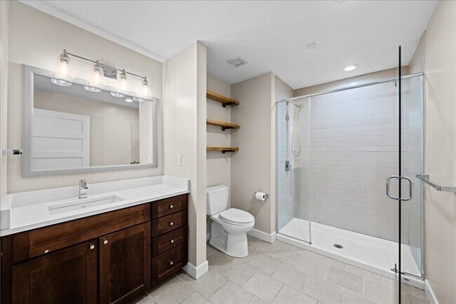 Building Photo - Stylish Industrial Loft with Exposed Brick, High Ceilings & Modern Kitchen