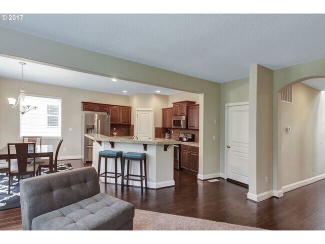 Building Photo - Bright and Open Floor Plan with Fireplace, Attached Garage & Vaulted Ceilings