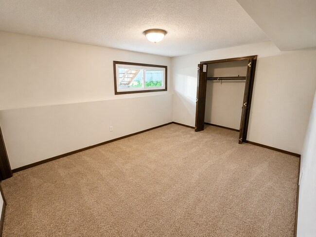 Building Photo - Spacious West Manhattan Home with Modern Updates, Oversized Garage & Prime Location