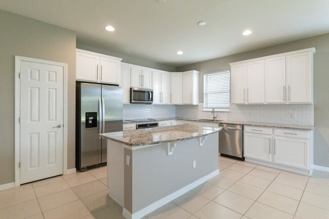 Building Photo - Gorgeous Energy Efficient 4/2 Home in Gated Community Close to Lake Nona