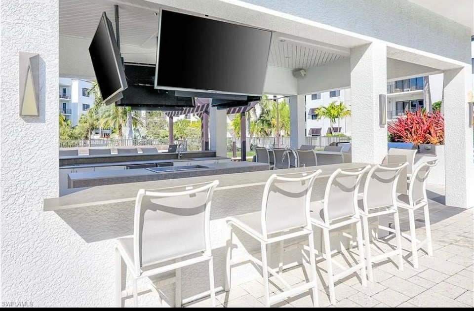 Outdoor TVs and music at pool - 1111 Central Ave