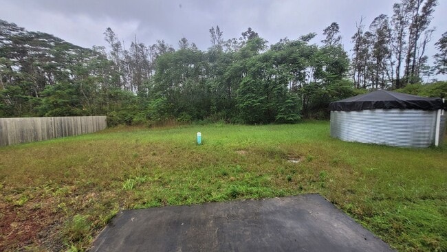 Building Photo - This 3-bedroom, 2-bath home in Orchidland Subdivision