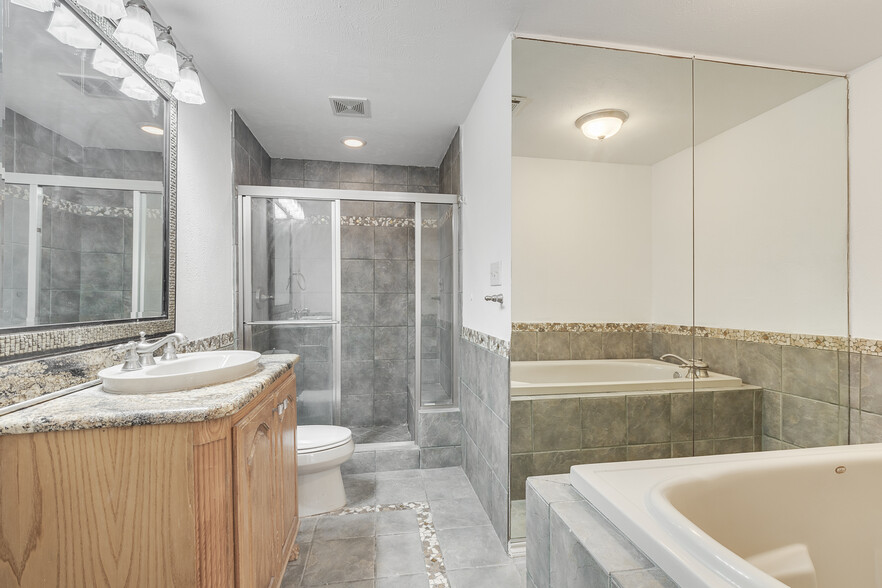 Master Bath with Stand-Up Shower and Jacuzzi Tub - 4023 Wycliff Ave