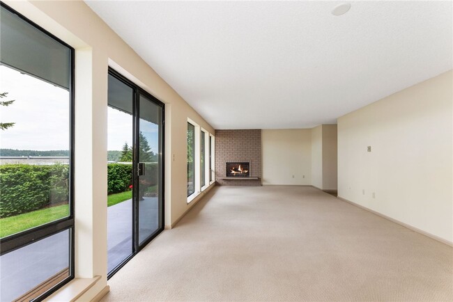 Great room with wood fireplace - 7400 Stinson Ave