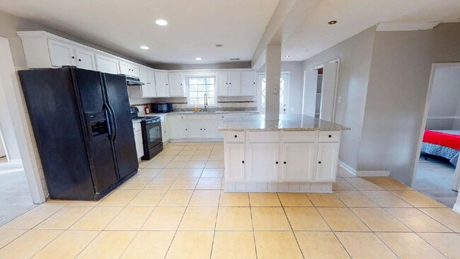 Building Photo - THE UNION GROVE | Gorgeous renovated home in Lithonia featuring large common areas, a spacious ki...