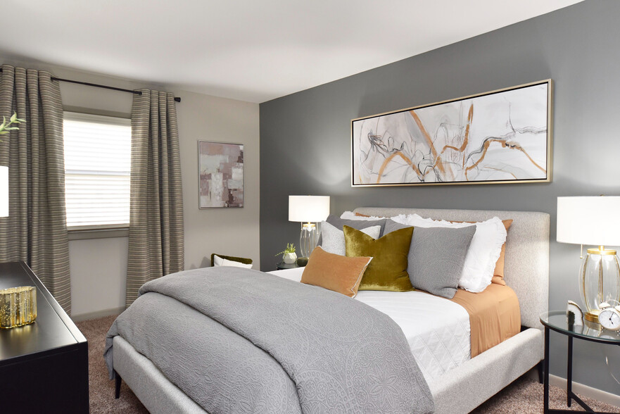 Experience serenity in this elegantly designed bedroom, where comfort meets style. - Edison at Meridian Hills