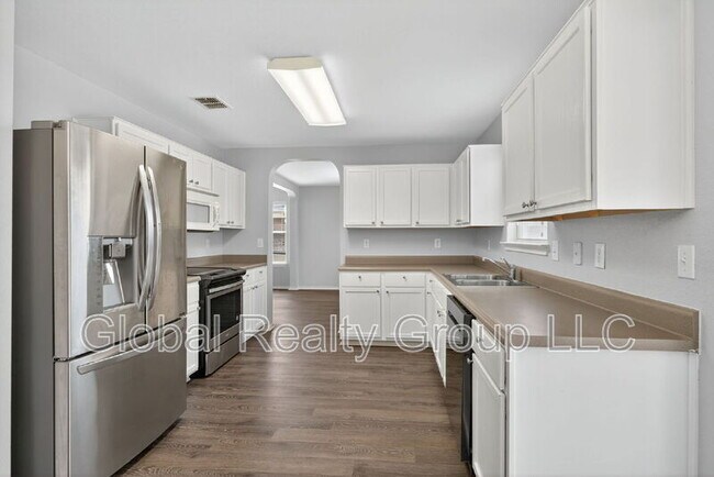 Building Photo - 10411 Artesia Wells