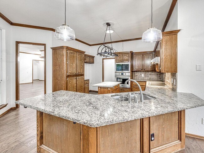 Building Photo - 4 Bedrooms - 3 Bathrooms - 3 Car Garage - ...