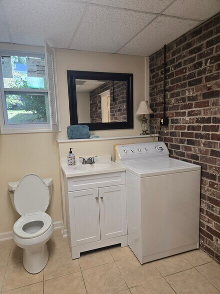 Bathroom w/ exposed brick - 106 Hickory St