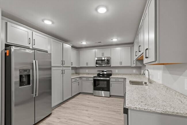 Building Photo - "Brand-New Townhome Awaits!"