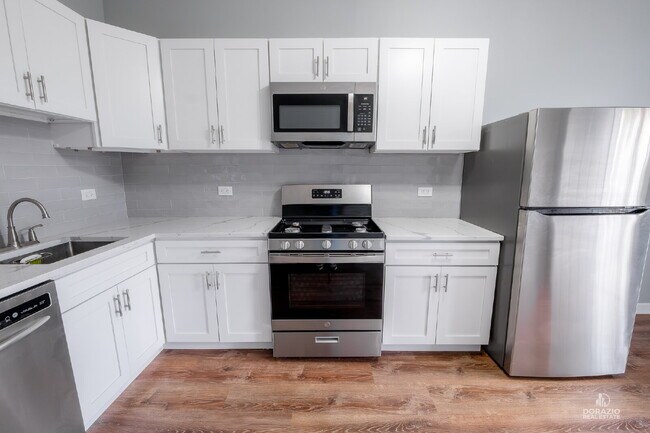 Building Photo - Modern 4BR Apartment with Hardwood Floors, Balcony & Central A/C