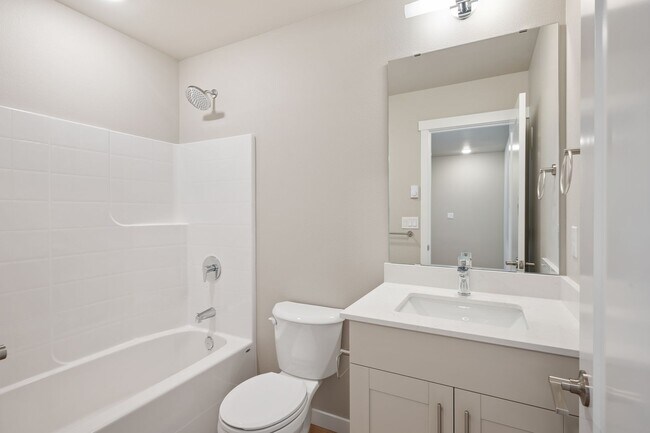 Building Photo - NEW CONSTRUCTION – Stylish 4-Bedroom Townh...
