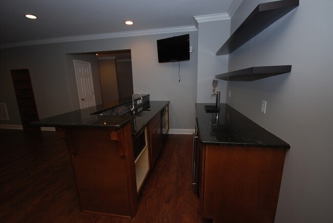 Building Photo - Oversized Executive Style Home with Finish...