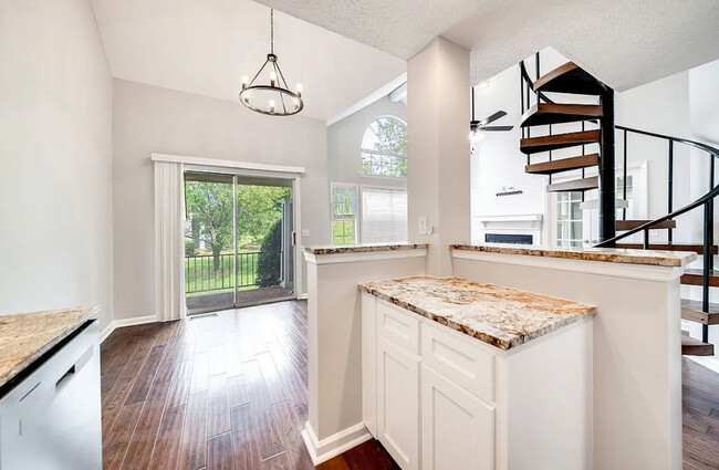 View from kitchen to dining and patio - 129 Cherry Hill Dr