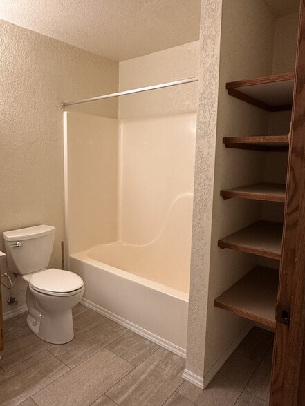 downstairs bathroom with storage area - 1008 Remington St
