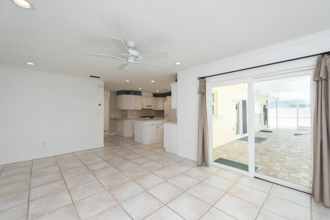 Building Photo - Live the ultimate Space Coast waterfront lifestyle at this stunning beachside canal home in Satel...