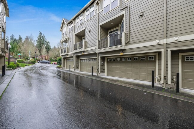 Building Photo - Lovely and bright townhouse with a hard wood flooring throughout, a 2 car garage, AC & more!