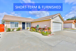 Park 2 cars in the garage, and the front yard and driveway can park up to 3 more cars. - 6730 Bullock Dr
