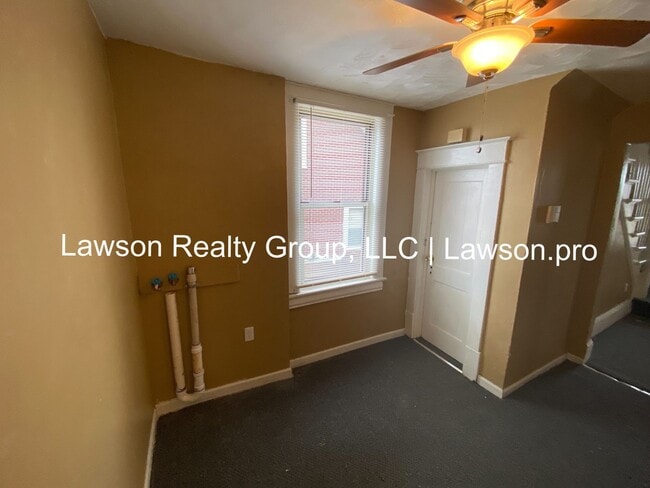 Building Photo - Updated Three Bedroom with Flat Yard