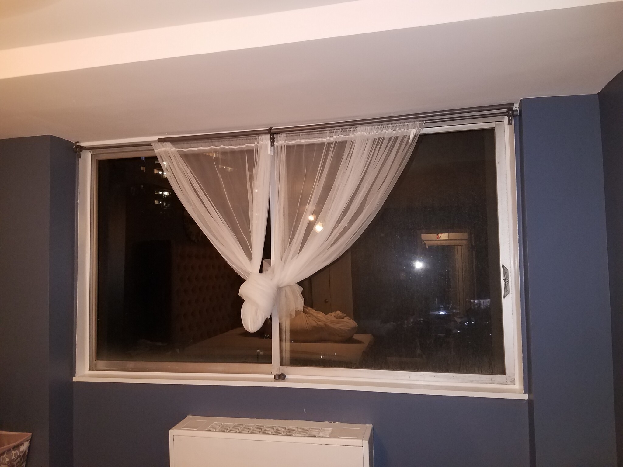 window in bedroom. New vertical blinds being installed - 301 N Beauregard St