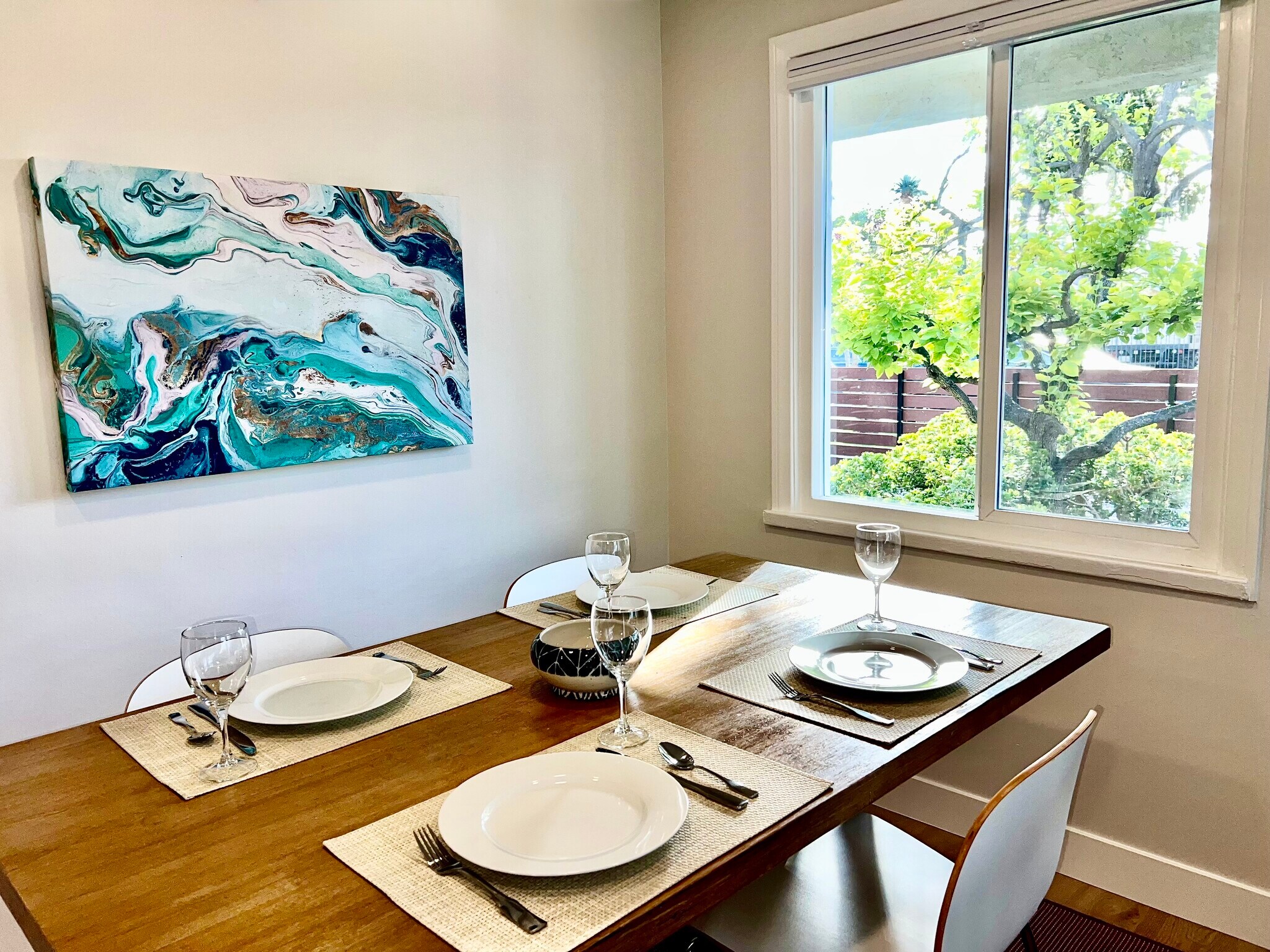 Beautiful leafy views from the West Elm dining table. - 2824 S Orange Dr