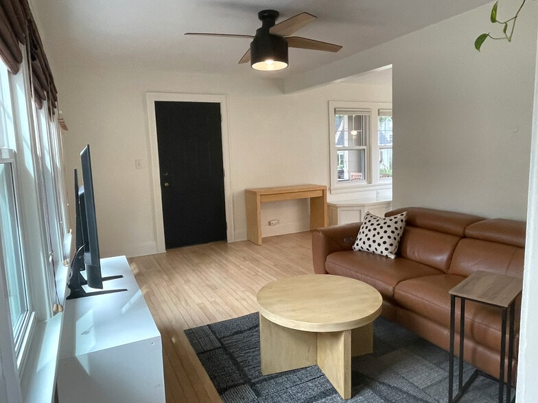 Spacious open layout with many windows and ceiling fan - 3209 Atwood Ave