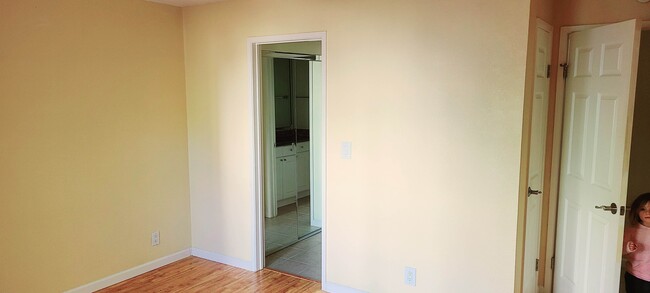 Primary bedroom to closets and bathroom. - 466 Crescent St