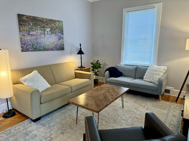 10ft ceilings in living room. - 189 Newton St