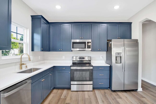 Building Photo - **Available now. This pet-friendly property features a small fenced yard with water and lawn main...