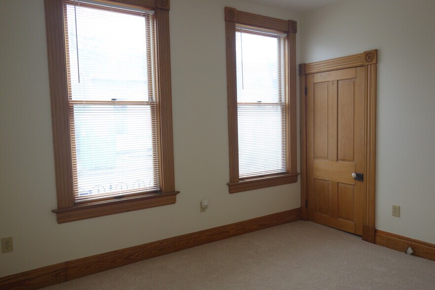 Large bedroom with two large windows. - 216 Kentucky