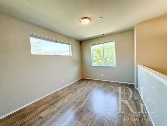 Building Photo - Modern End-Unit Townhome with Private Fenced Yard, Gourmet Kitchen & Spacious Layout
