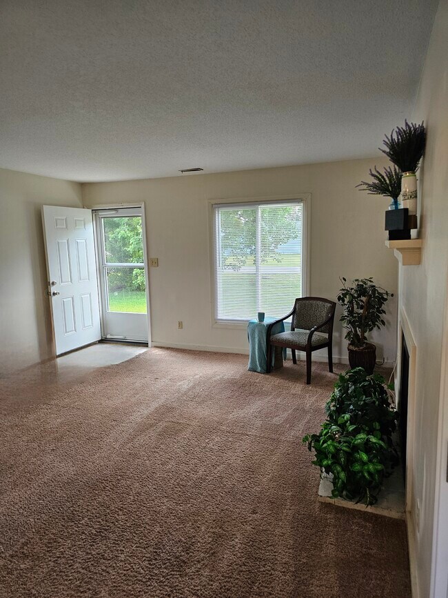 Living room (now has luxury vinyl plank floors) - 404 Rams Rd