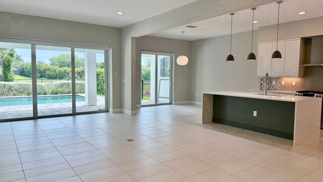 Building Photo - Rare Lakefront Pool Home in Exclusive Gated Sandhill Lake – Resort-Style Living Awaits