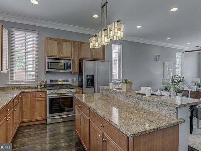 Building Photo - Beautiful EOG 3 bedroom  2.5 bath townhome with a 2 car garage and roof top deck overlooking the ...