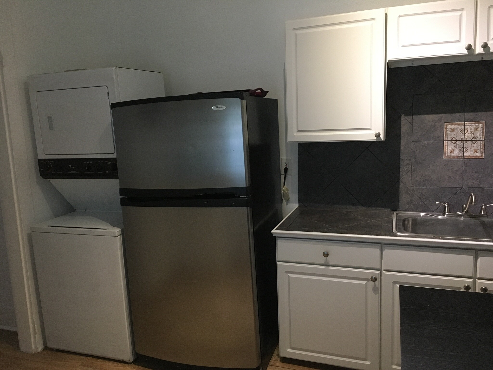 Kitchen with washer and dryer - 7602 Burthe St