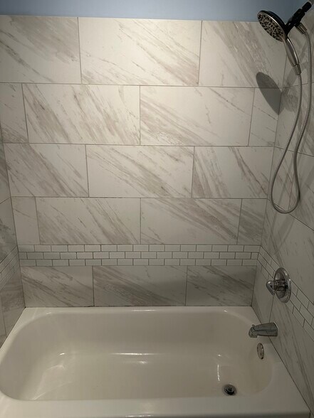 Fully tiled bath tub with new rain shower head, - 751 S 22nd St