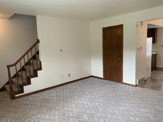 Living room includes coat closet. This unit has all new carpet! - 1320 5th St W