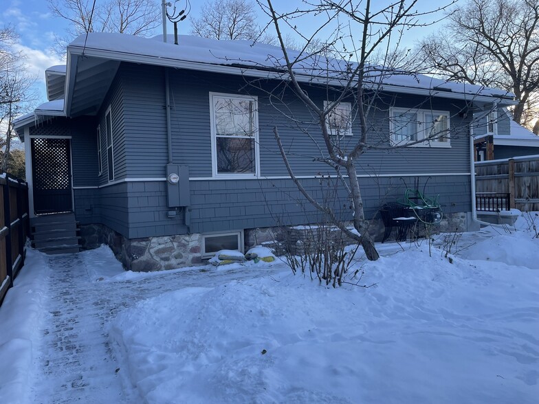 rear of home showing access to back door and paver patio area - 508 Daly Ave