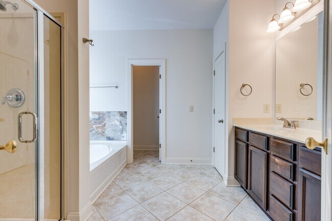 Building Photo - Welcome to this charming end unit townhome