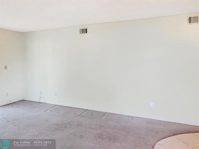 Building Photo - 6090 N Sabal Palm Blvd