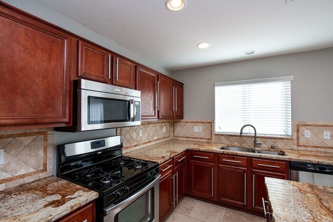 Building Photo - Welcome to this stunning 4 bedroom, 2.5 ba...