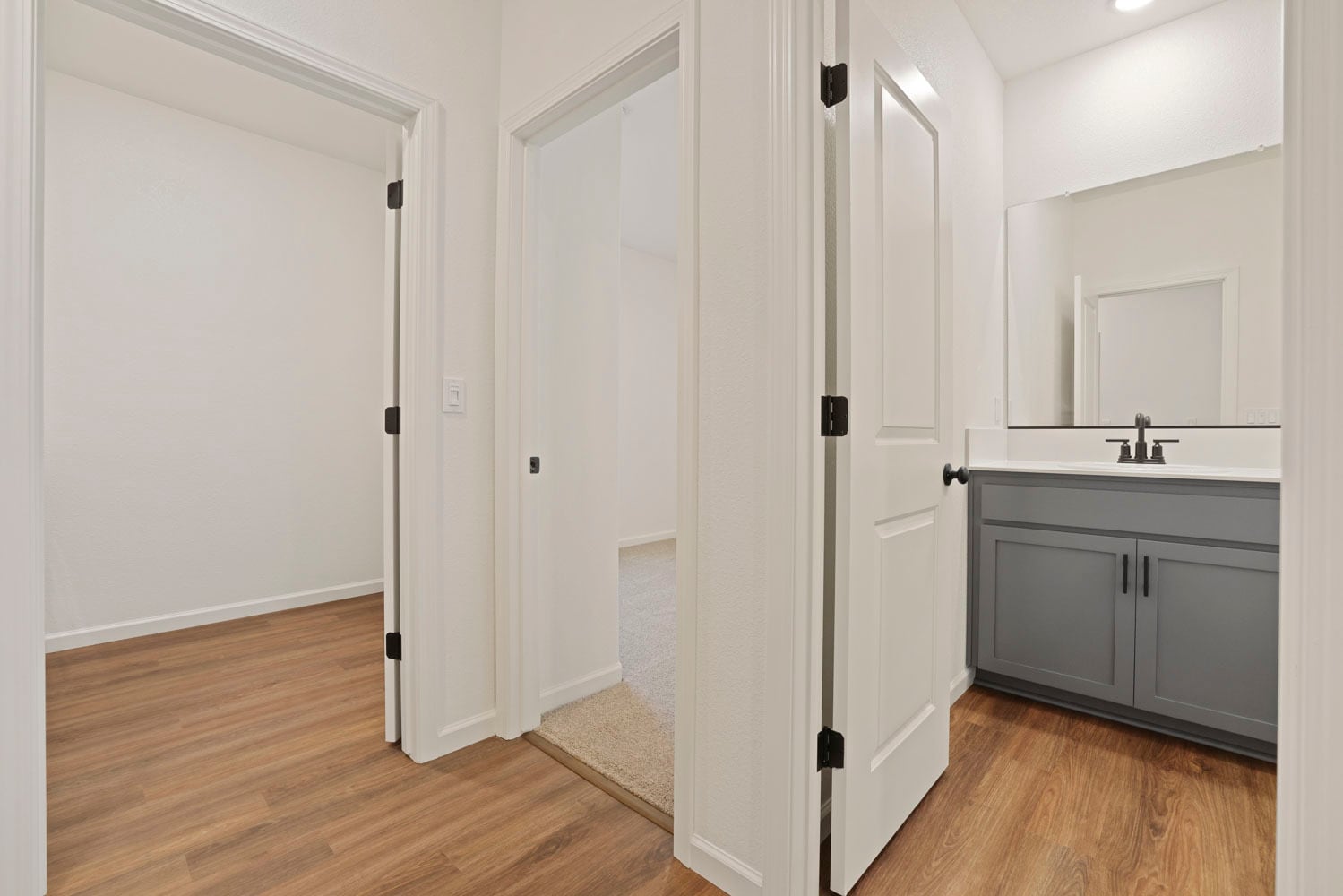 Hallway to Bedroom 2, Shared Bath and Laundry - 522 Bedfordshire Dr